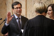 WA Gov. Bob Ferguson says he’s drafting a cuts