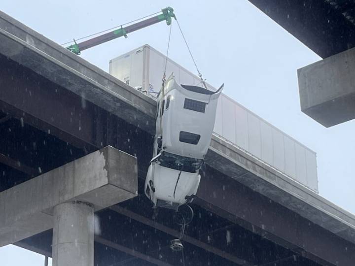 Driver rescued from semitrailer hanging over bridge on West Virginia highway