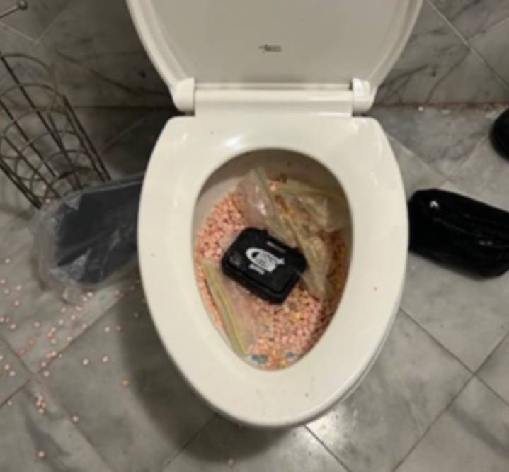 Brockton man caught trying to flush pills while on home confinement, officials say