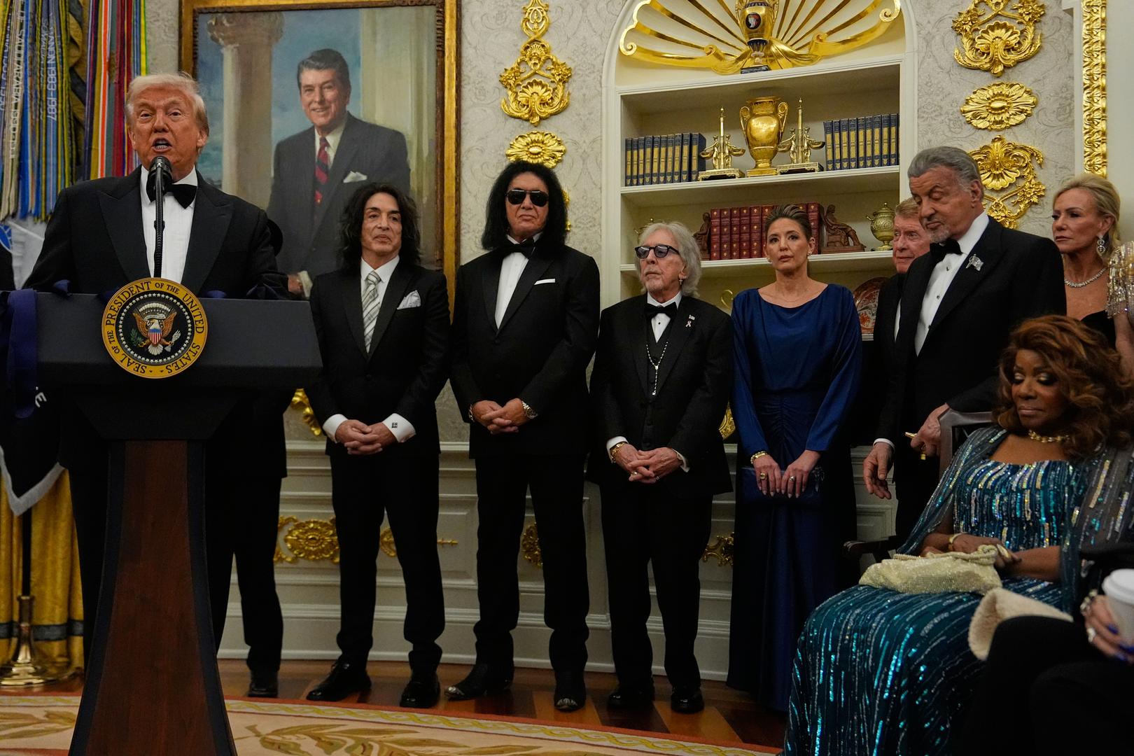 Trump awards medals to the Kennedy Center honorees in an Oval Office ceremony