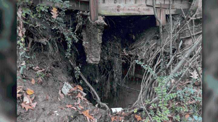 Woman says city responsible for large sinkhole in yard