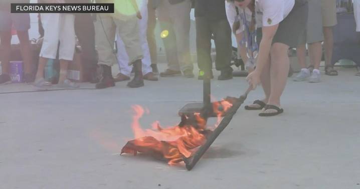 Hurricane Warning flags burned to celebrate end of season in Key West