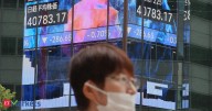 Japan's Nikkei climbs on Wall Street relief rally; tech shares slip