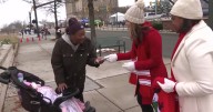 Kristen and Reba spread holiday cheer by giving out gift cards at Dominion Energy Christmas Parade