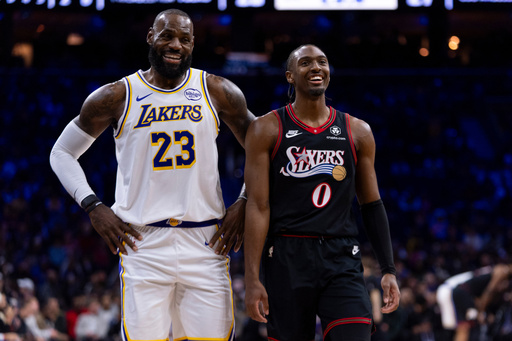 James hits go-ahead 3 and scores 29 points, Doncic has triple-double in Lakers' win over 76ers