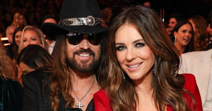 Elizabeth Hurley Wears Fully Sheer Minidress & Cuddles Billy Ray Cyrus