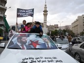 With flags and fireworks, Syrians celebrate one year since fall of al