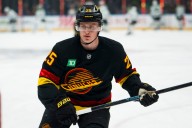 Canucks Reassign Nikita Tolopilo, Elias Pettersson