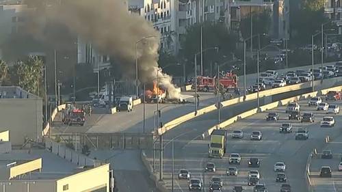 Lanes shut down for hours at NB 405/101 interchange in Sherman Oaks after flatbed truck loaded with hay erupts in flames