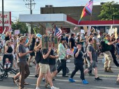 Safety volunteer charged in the fatal shooting of a Utah 'No Kings' protester