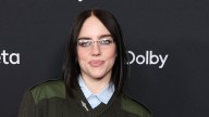 Billie Eilish, 23 poses for rare photo with parents she lives with in tiny LA house