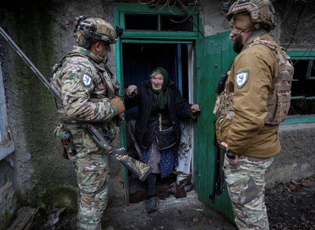 As Putin’s army closes in, some Ukrainians are refusing to leave their homes