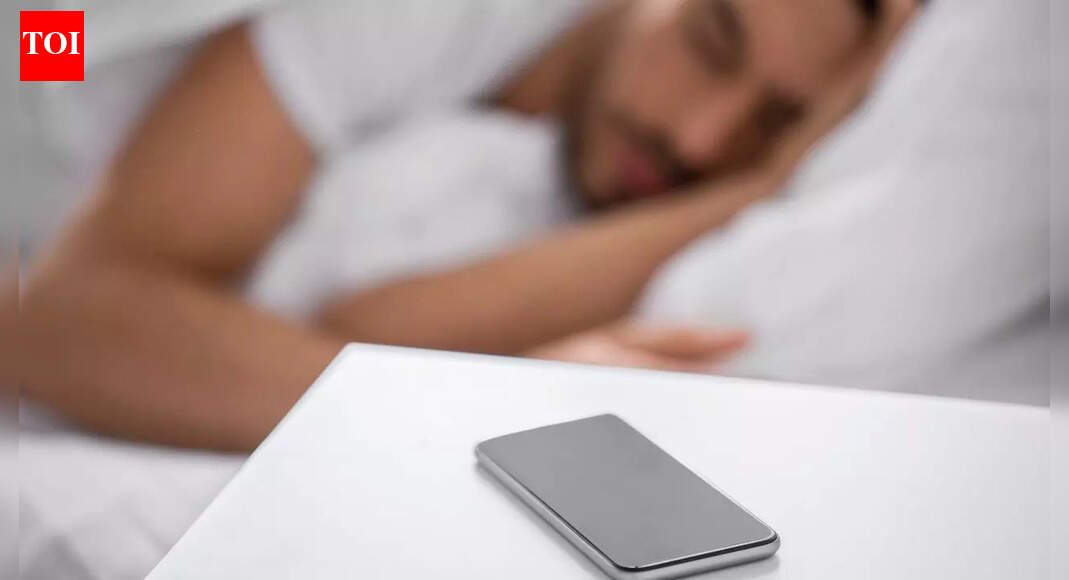 Sleeping next to your phone may cause brain cancer, fertility issues, and other hidden health risks, experts warn about