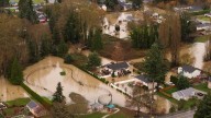Washington flooding forces entire city to temporarily evacuate as rivers reach historic highs