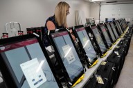 Georgia election board rejects rule change on using hand