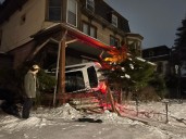 1 sent to hospital after car crashes into Troy building