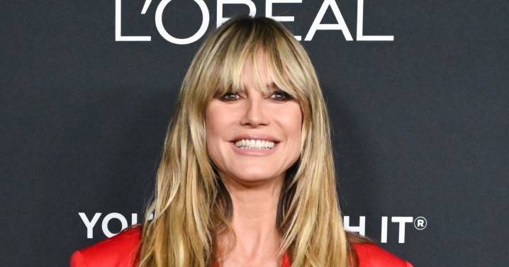 Heidi Klum’s Red Lacy Tights Steal the Show