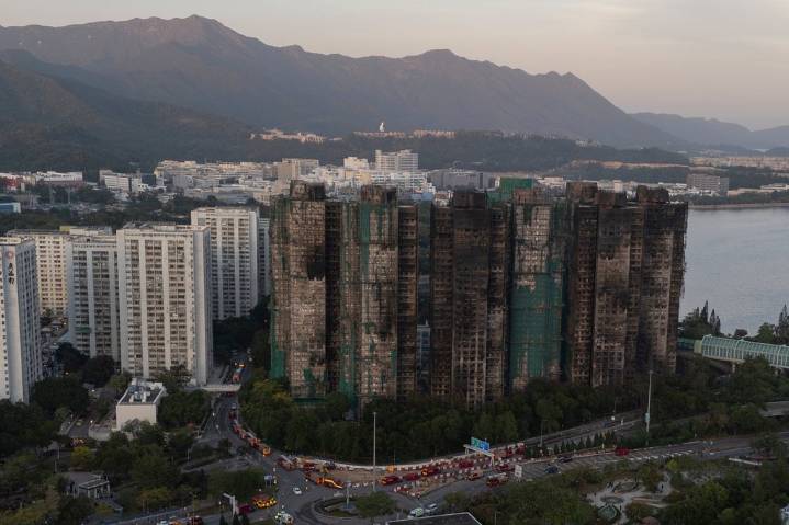 Hong Kong police arrest man for posts about deadly fire
