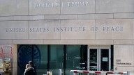 Trump is fighting the Institute of Peace in court. Now, his name is on the building
