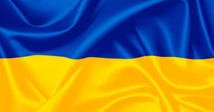 A flash mob waves Ukrainian flags as La Scala features a Russian opera for its gala season premiere