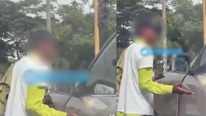 MOMENTO EXACTO en que limpiaparabrisas agrede a conductor por rechazar el servicio