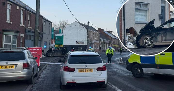 LIVE: Car crashes into house closing road in New Herrington