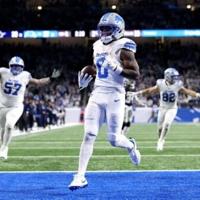 Gibbs runs for three TDs as Lions down Cowboys to boost NFL playoff bid