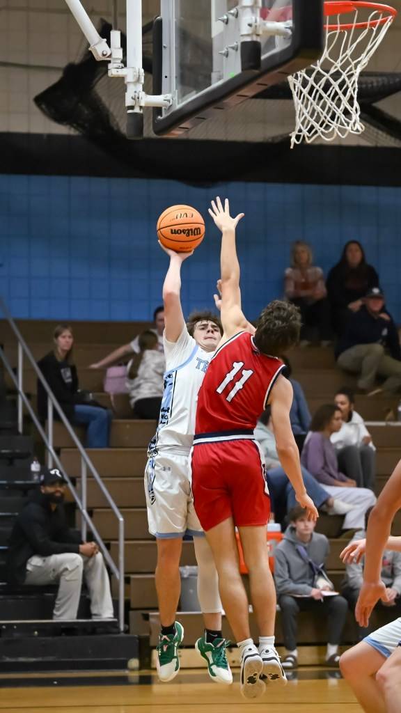 High school boys basketball: Mustangs fall to powerful Robinson squad