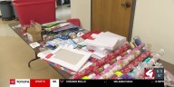 Volunteers wrapping presents for children in foster care in Siouxland