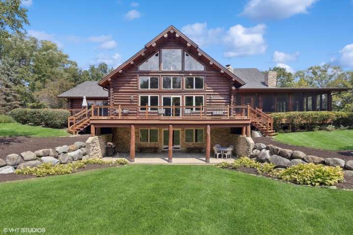 Orland Park 6-bedroom log cabin with fishing pond: $1.2M