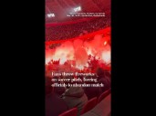 Fans throw fireworks on soccer pitch, forcing officials to abandon match