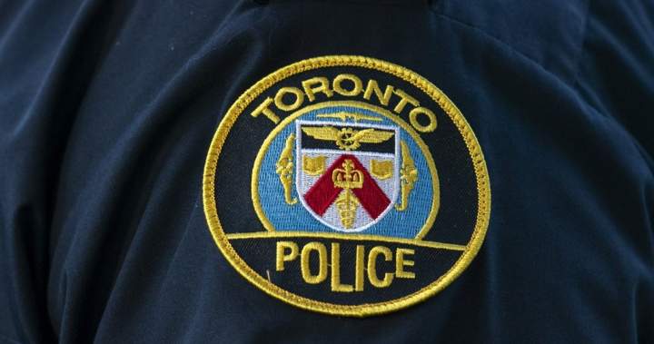 Toronto police say officer pulled woman on fire from tent