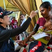 Anguished Sri Lankans queue for care after deadly cyclone