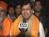 Sukanta Majumdar serves food to devotees ahead of mass Gita recit