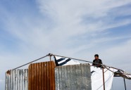 Desperate Gazans pull iron bars from rubble to construct tents and scratch out a living