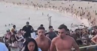 Horror moment gunmen open fire on Bondi Beach as terror sparks panic in Sydney 