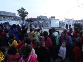 Makeshift movie screenings in Gaza City bring children ‘out of the ruin’