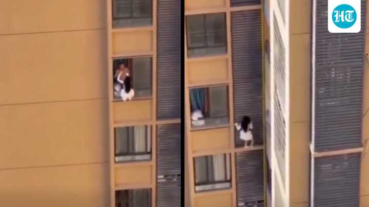Shocking video shows woman clinging to 10th-floor wall to avoid lover’s wife