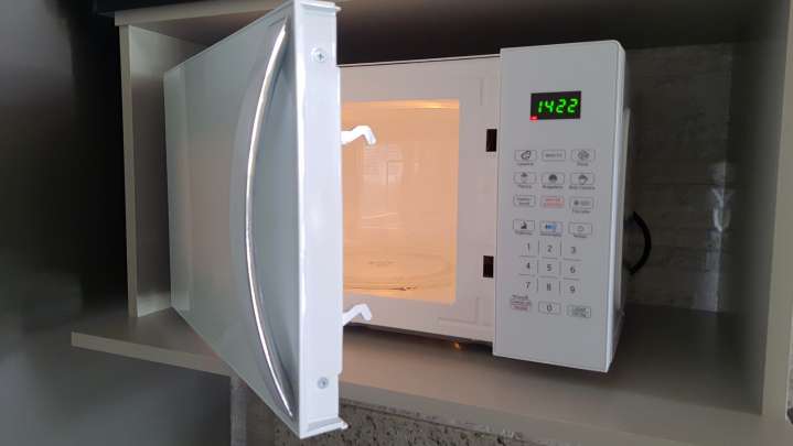 Hide Microwave Eyesores In Your Kitchen With A Fast And Affordable DIY Solution