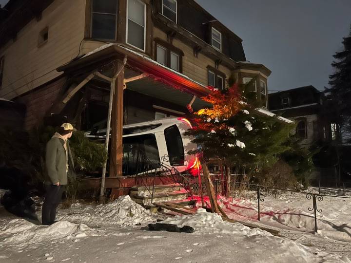 1 sent to hospital after car crashes into Troy building