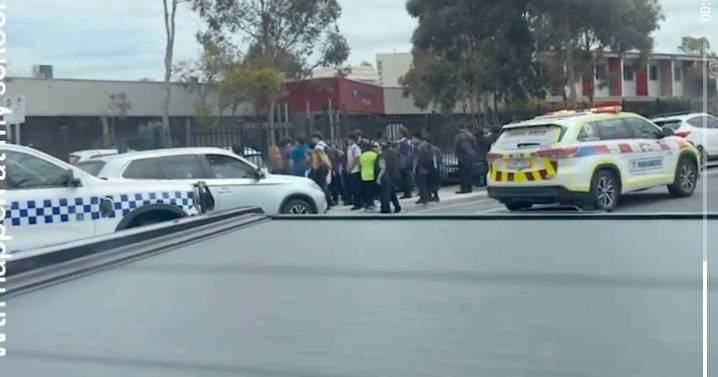 Melbourne school principal 'stabbed by employee' as children told to hide under tables