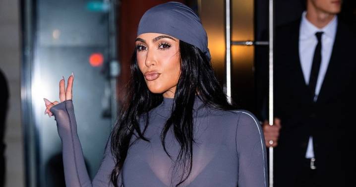 Kim Kardashian Poses With Christmas Decor in Fun Ski Look