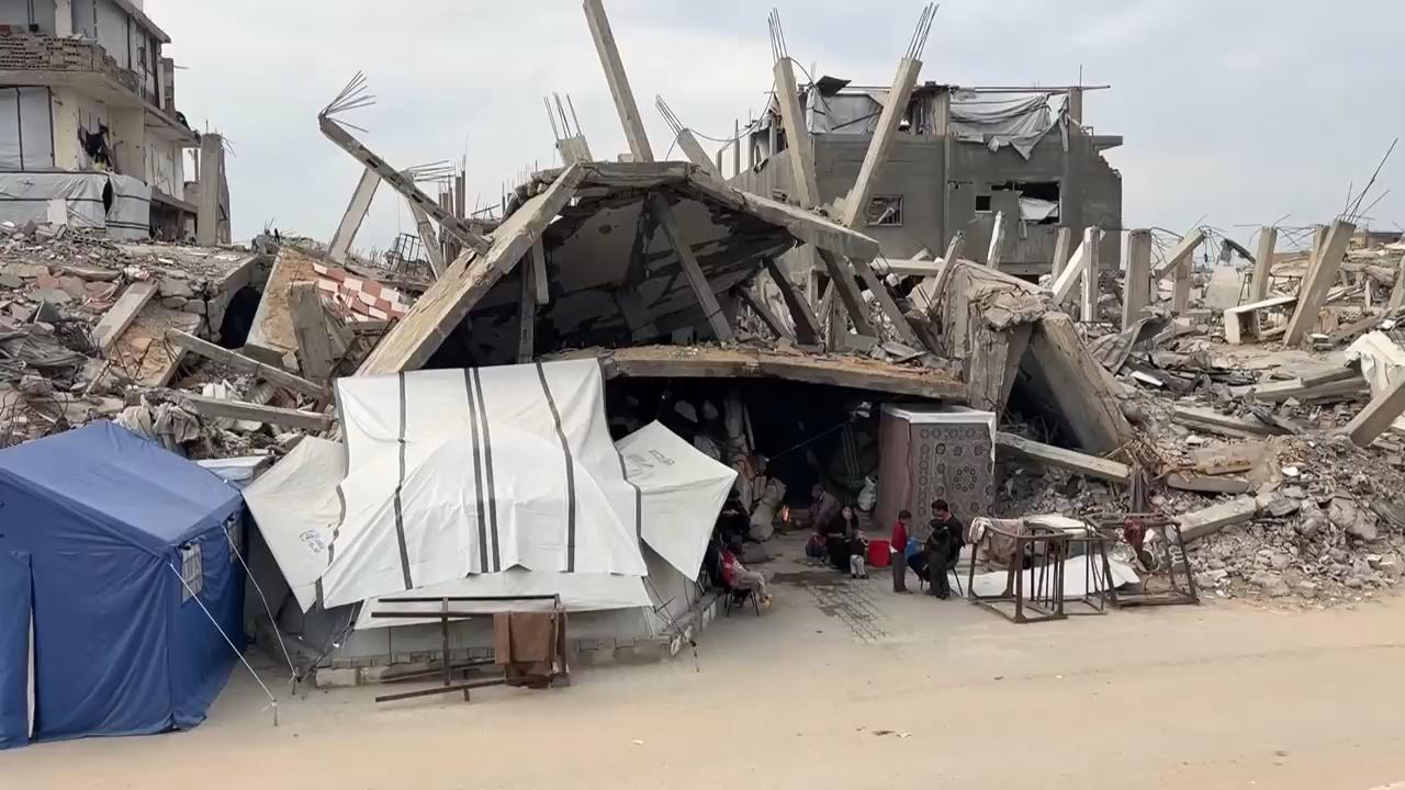 In a near-destroyed area of northern Gaza, families rely on firewood for cooking