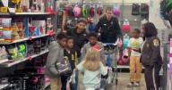 Officers and deputies help 125 kids shop for Christmas gifts: 'It's really fun'
