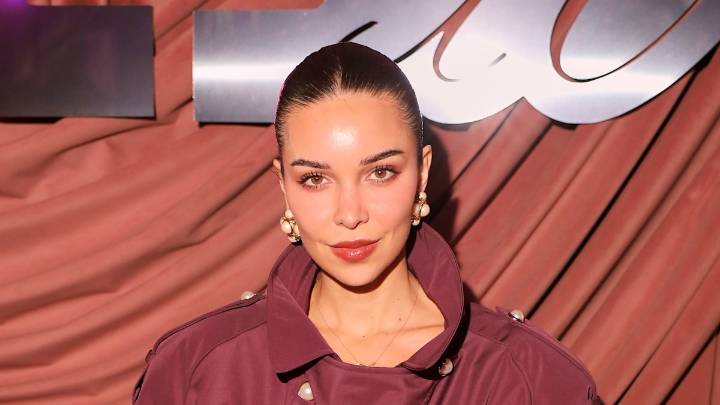 Jackie Apostel takes cues from Victoria Beckham in oxblood trench coat and leather accessories