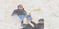Families sled at Chautauqua Park during snow day