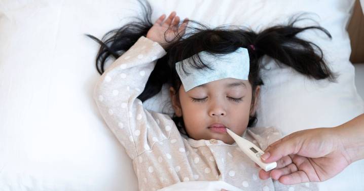 All we know as flu spike sees kids miss school and rules change