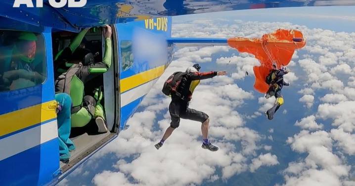 Skydiver dangles at 15,000 feet after parachute catches on plane's tail in Australia