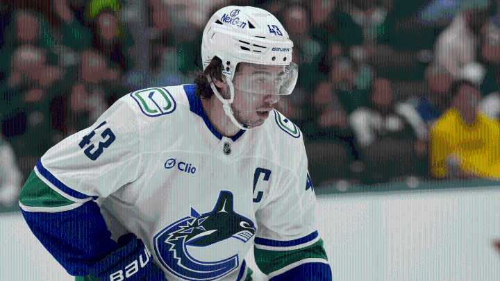 Hughes traded to Wild by Canucks