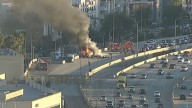 Lanes shut down at NB 405/101 interchange in Sherman Oaks after flatbed truck loaded with hay erupts in flames